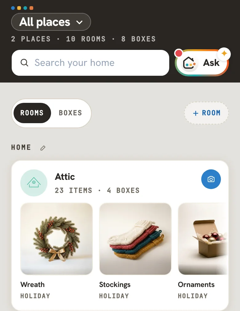 At Home in Caboodle: All places, 2 places · 10 rooms · 8 boxes, Search your home and Ask, ROOMS or BOXES, + Room, and the Attic card, 23 items · 4 boxes, with the wreath, the stockings and the ornaments